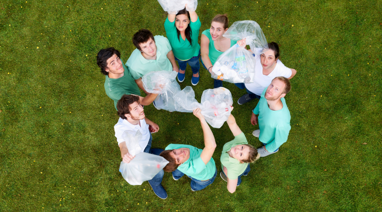 people-holding-garbage-bags-on-grass-2022-03-04-01-48-49-utc 1